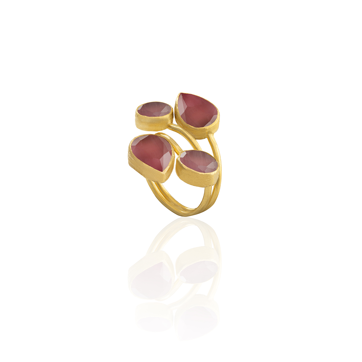 Gold ring with red gemstones on a white background